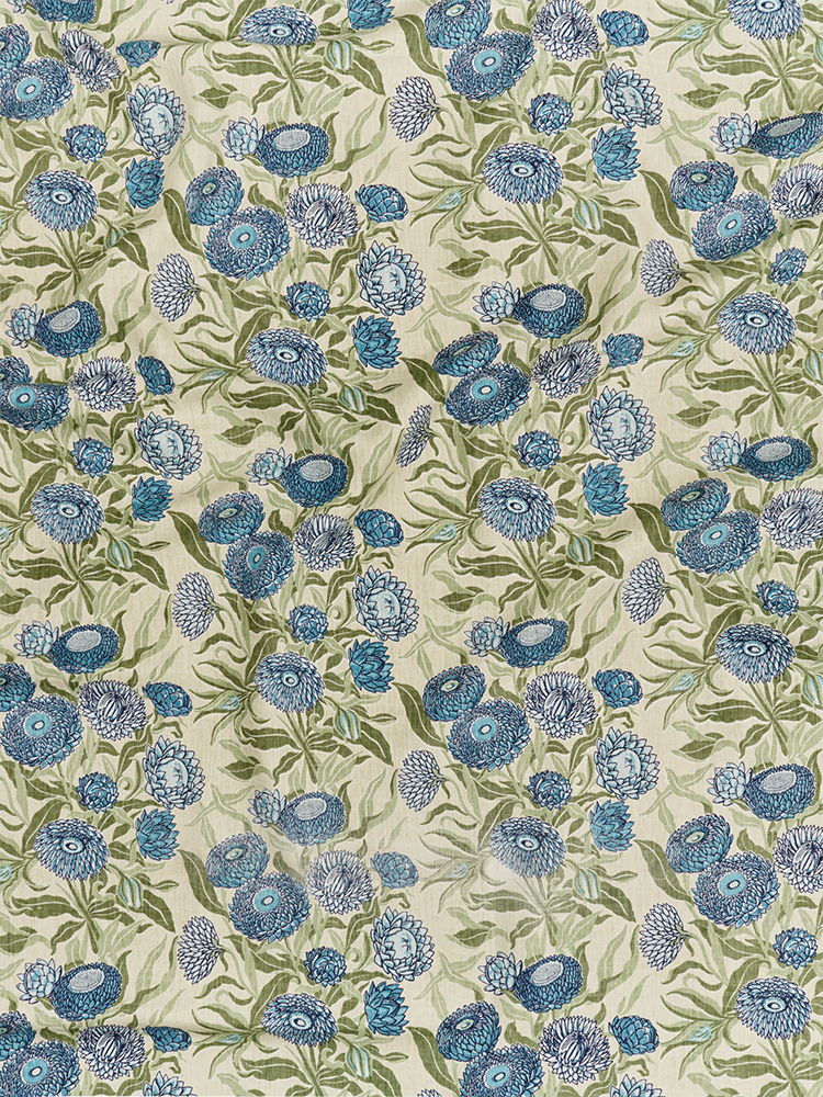 Utopia Goods: floral fabric pattern with blue flowers and green leaves on cream background