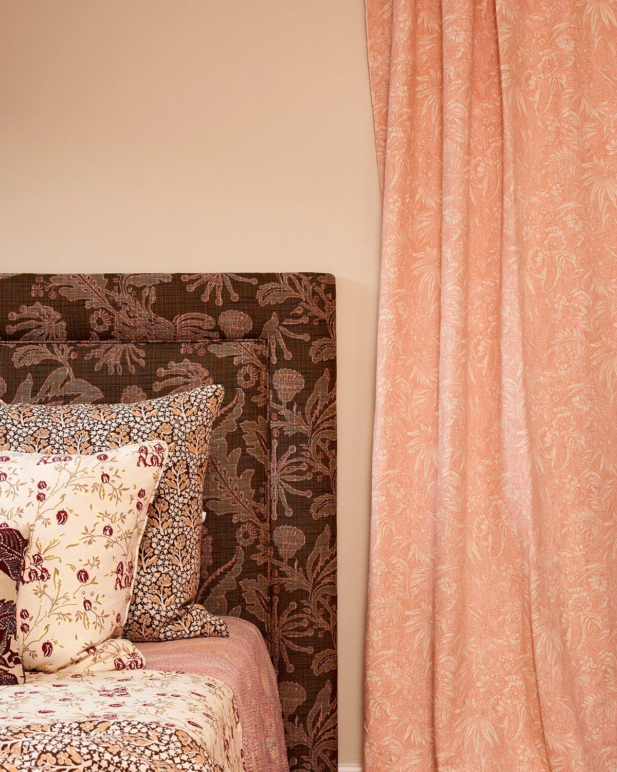 Utopia Goods Palm Grove Pink Furnishing Linen: coral pink curtains with botanical print hanging beside bed with matching pillows