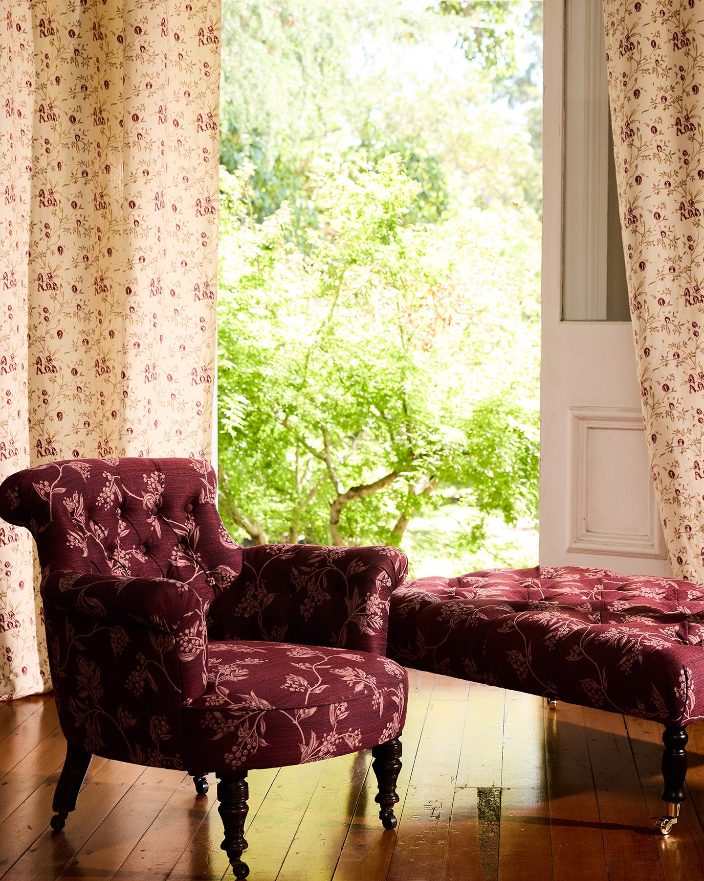 Utopia Goods Antique Victorian Button-Back Chair - Wattle Performance fabric: burgundy floral upholstered chair with matching ottoman by window