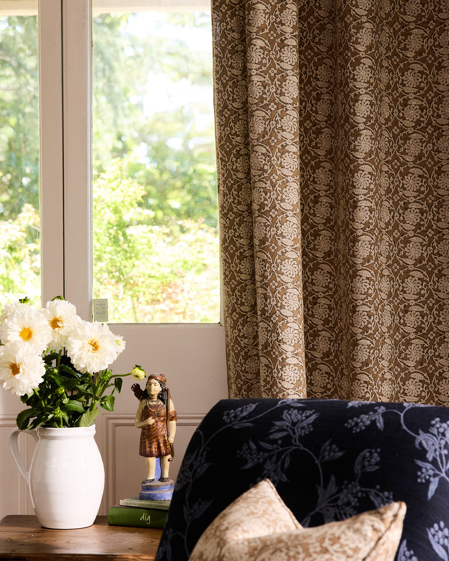 Utopia Goods Pinwheel Sepia Furnishing Linen: brown and cream floral patterned curtains hanging beside window in styled room