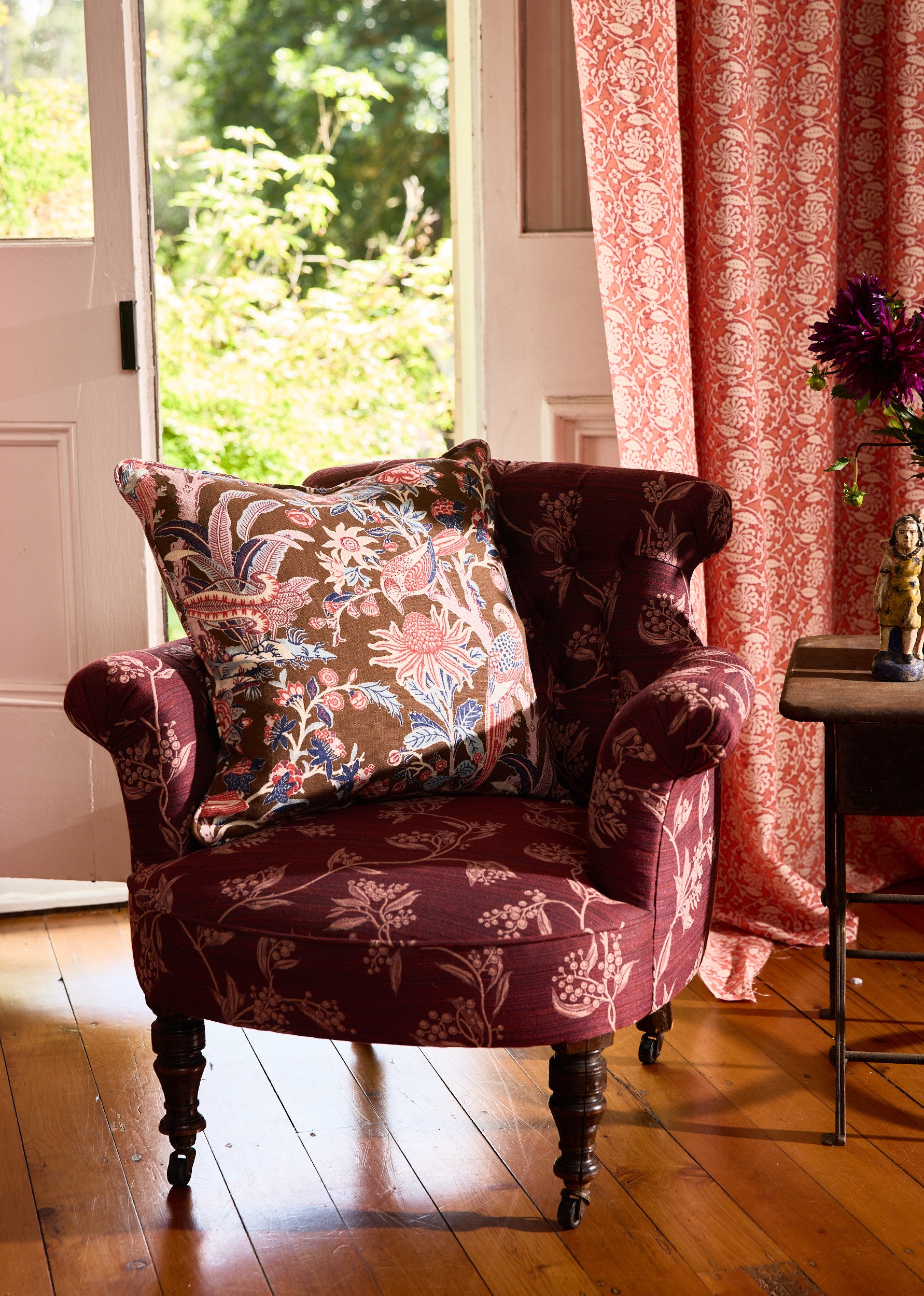 Utopia Goods Arcadia Mocha Medium Cushion Cover: floral printed cushion on burgundy velvet chair in elegant room setting