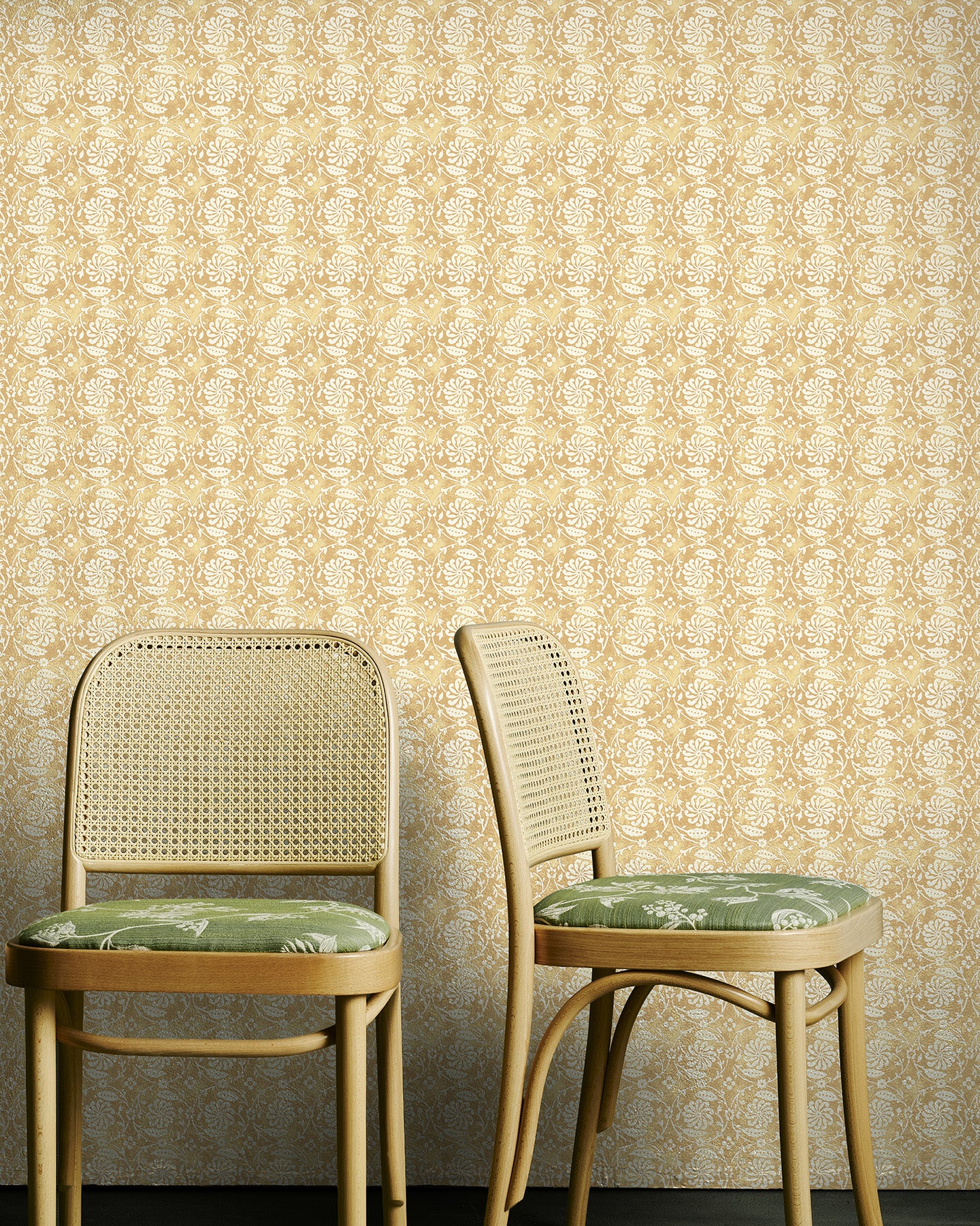 Wattle Green chairs against Utopia Goods yellow wallpaper - Designer floral wallpaper - Pinwheel Haystack Wallpaper