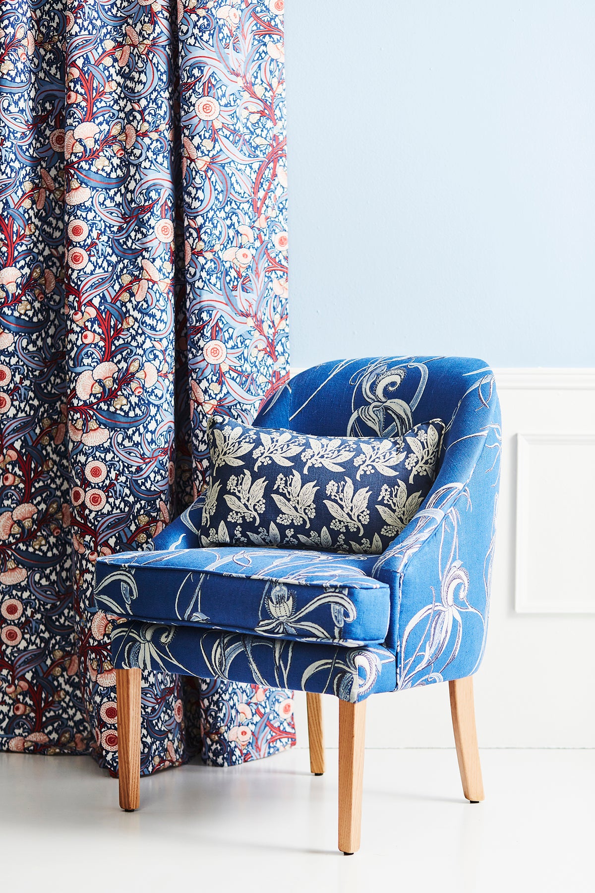Utopia Goods Native Orchid Blue Heavyweight Linen Exclusive: blue floral upholstered chair with matching curtains in room setting